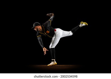 Preparing For Double. Professional Baseball Player, Pitcher In Sports Uniform And Equipment Practicing Isolated On A Black Studio Background. Competition, Show And Team Sport Concept. Copy Space For