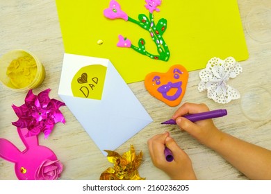 Preparing For Fathers Day, Birthday Or Valentines Day . Child Making Funny Crafts, Greeting Card From Paper And Clay, Plasticine.  Arts  Crafts Concept.