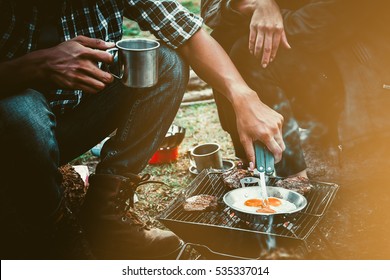 Preparing Food On Campfire In Wild Camping