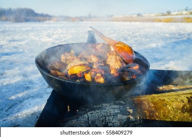 Preparing food on the grill in the winter