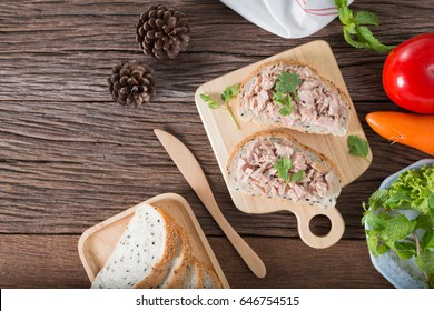 Preparing Fresh Homemade Tuna Sandwich With Sesame Bread On Plate. Top View And Copy Space.