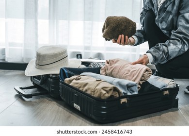 Preparing for a Getaway, Packing Essential Items in Suitcase