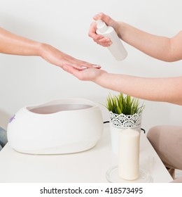 Preparing Hand For Paraffin Wax Bath In Beauty Salon