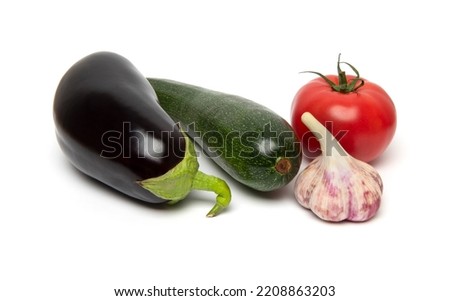 Preparing Healthy Food, Vegeterian, Vegan Concept. A set of fresh whole vegetables: zucchini, eggplant, tomato and garlic.