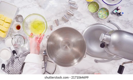 Preparing Italian buttercream frosting in standing kitchen mixer.