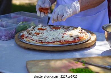 Preparing Italian Food In A Park Pizza Spagetti Salad