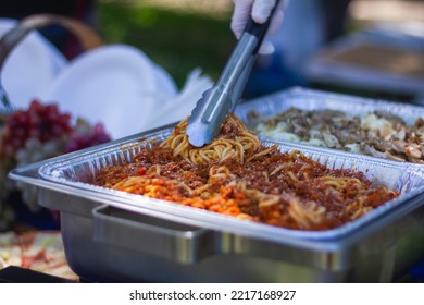 Preparing Italian Food In A Park Pizza Spagetti Salad