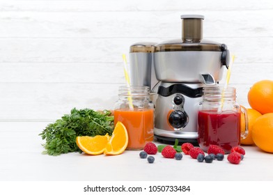 Preparing juice from fresh fruits and vegetables. Electric juicer, healthy lifestyle concept - Powered by Shutterstock