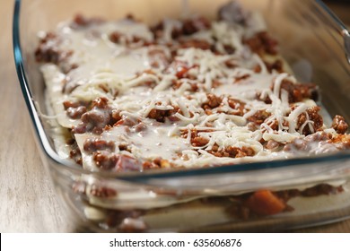 Preparing Lasagna Process On Home Kitchen For Family Dinner, Shallow Focus