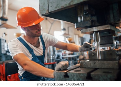 Preparing material. Man in uniform works on the production. Industrial modern technology. - Shutterstock ID 1488064721