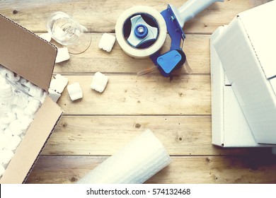 Preparing For Moving. Packing Supplies On A Vintage Wooden Table