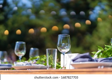 Preparing for an open-air party. Decorated served tables await guests. Decoration Details.