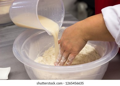 Preparing organic bread with people in the kitchen - Powered by Shutterstock