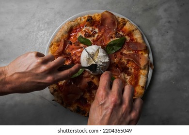 Preparing Pizza In A Restaurant For Clients In Tenerife