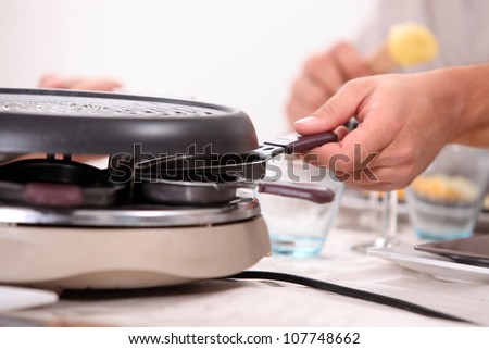Preparing the raclette machine