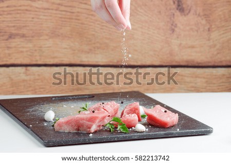 Preparing Raw Meat With Spices And Garlic For Cooking