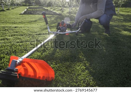 Preparing and Refueling Grass Trimmer – Maintenance and Startup Process for Lawn Care