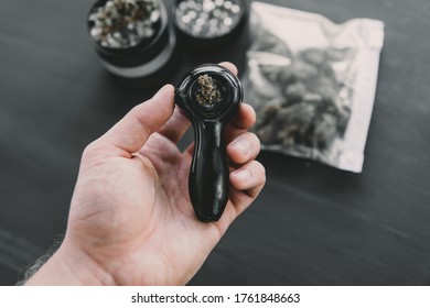 Preparing and rolling Close up of marijuana blunt with grinder. marijuana Rolling a marijuana joint.