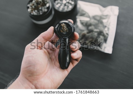 Preparing and rolling Close up of marijuana blunt with grinder. marijuana Rolling a marijuana joint.