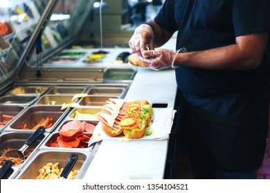 Preparing Sandwich In The Restaurant. The Kitchen Of Fast Food Restaurant