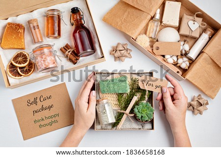 Preparing self care package, seasonal gift box with plastic free zero waste cosmetics products. Personalized eco friendly basket for family and friends for christmas, mothers day  