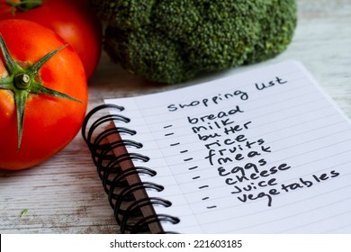 Preparing the shopping list before going to buy the groceries.  - Shutterstock ID 221603185
