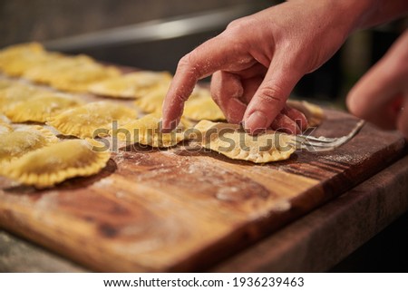 Preparing traditional italian ravioli. Homemade italian pasta.
