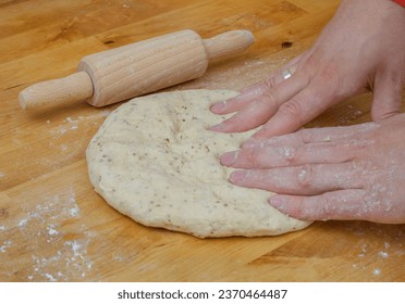 Preparing Turkish pita bread from raw dough - Powered by Shutterstock