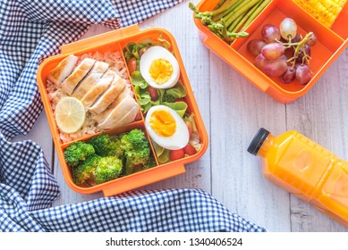 Preparing Various Healthy Lunch Boxes In Orange Packaging. Office Lunch Box. Healthy Eating Habits Concept, Flat Lay Composition.