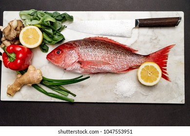 Preparing A Whole Red Snapper For Cooking.