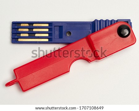 Prepayment meter key, red & blue.