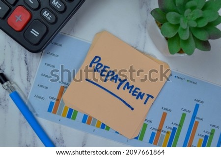 Prepayment write on sticky notes isolated on Wooden Table.