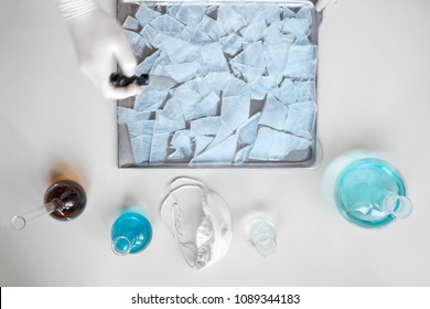 Prepearing Meth In Home Chemistry Lab. Hand Of Man, Breaking Chemical Crystals On A Tray