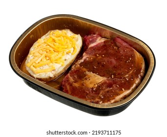 Prepped Meal Serving In Tin Container. Rib-eye Steak With Twice-Baked Potato. Isolated On White.