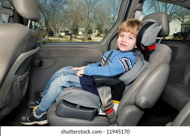 Preschool Age Boy In A Booster Seat