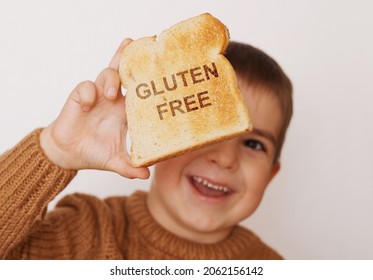 Preschool Boy With Toasted Bread Without Gluten. Healthy Food. Gluten Intolerance By Children.