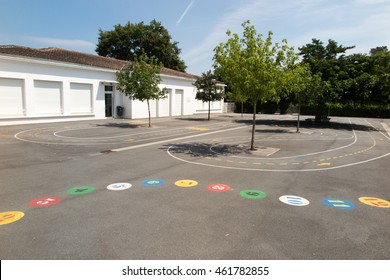 Preschool Building Exterior With Playground On A Sunny Day
