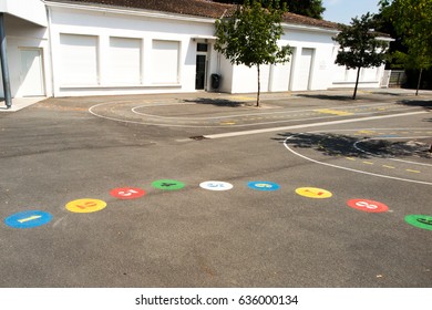 Preschool Building Exterior With Playground On A Sunny Day