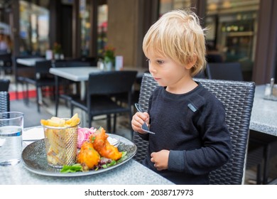 Preschool Child, Cute Boy, Eating Fish And Chips A Restaurant, Cozy Atmosphere, Local Small Restaurant In Stockholm, Sweden