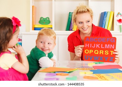 pre-school children in the classroom with the teacher