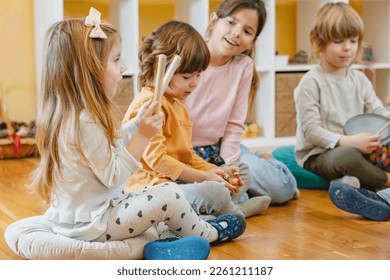 Preschool children with instruments in a music class - Shutterstock ID 2261211187