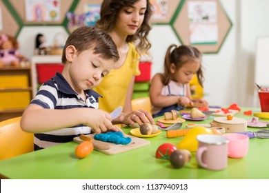 Preschool Children And Teacher In Classroom