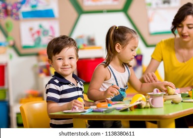 Preschool Children And Teacher In Classroom