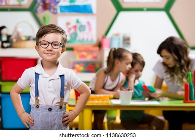 Preschool Children And Teacher In Classroom