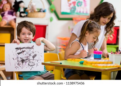 Preschool Children and Teacher in Classroom - Shutterstock ID 1138975436