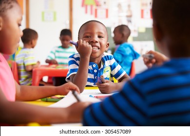 Preschool Class In South Africa, Boy Looking To Camera