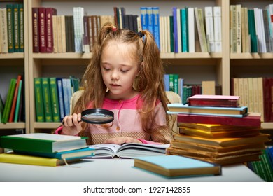 Preschool Girl Reading Book In Library With Patience, Caucasian Kid Girl Is Concentrated On Education, Getting Knowledge. Child S Brain Development, Learn To Read, Cognitive Skills Concept