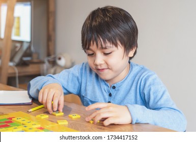 Preschool Kid Learning English Words Game,Child Boy Concentrated With Spelling English Letter With Parent At Home. Distance Education ,Activity For Children For Home Schooling During Self Isolation