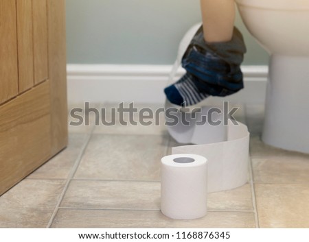 preschool toilet child sized preschool kid sitting on toilet and playing with rollslow view of legs kid sitting on toilet playing stock photo edit now preschool toilet child sized preschool kid sitting on toilet and playing with rollslow view of legs kid sitting on toilet playing stock photo edit now