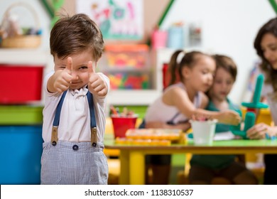 Preschool Student Posing In Classroom